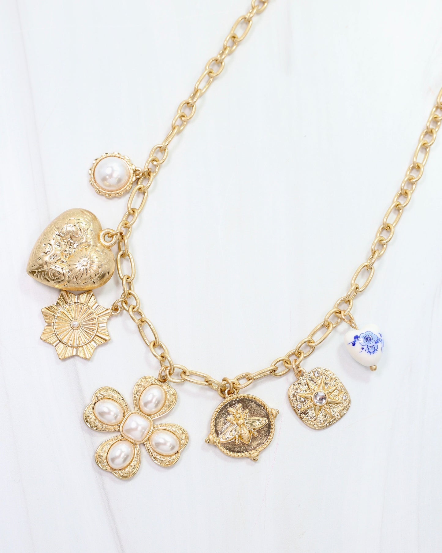 Verona Gold and Pearl Charm Necklace Worn Gold