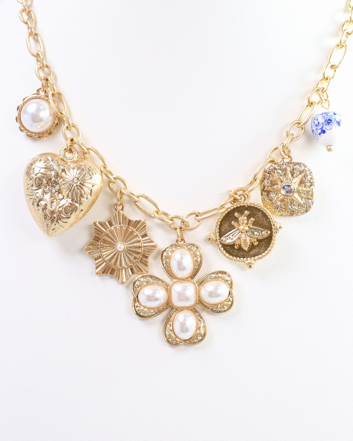 Verona Gold and Pearl Charm Necklace Worn Gold