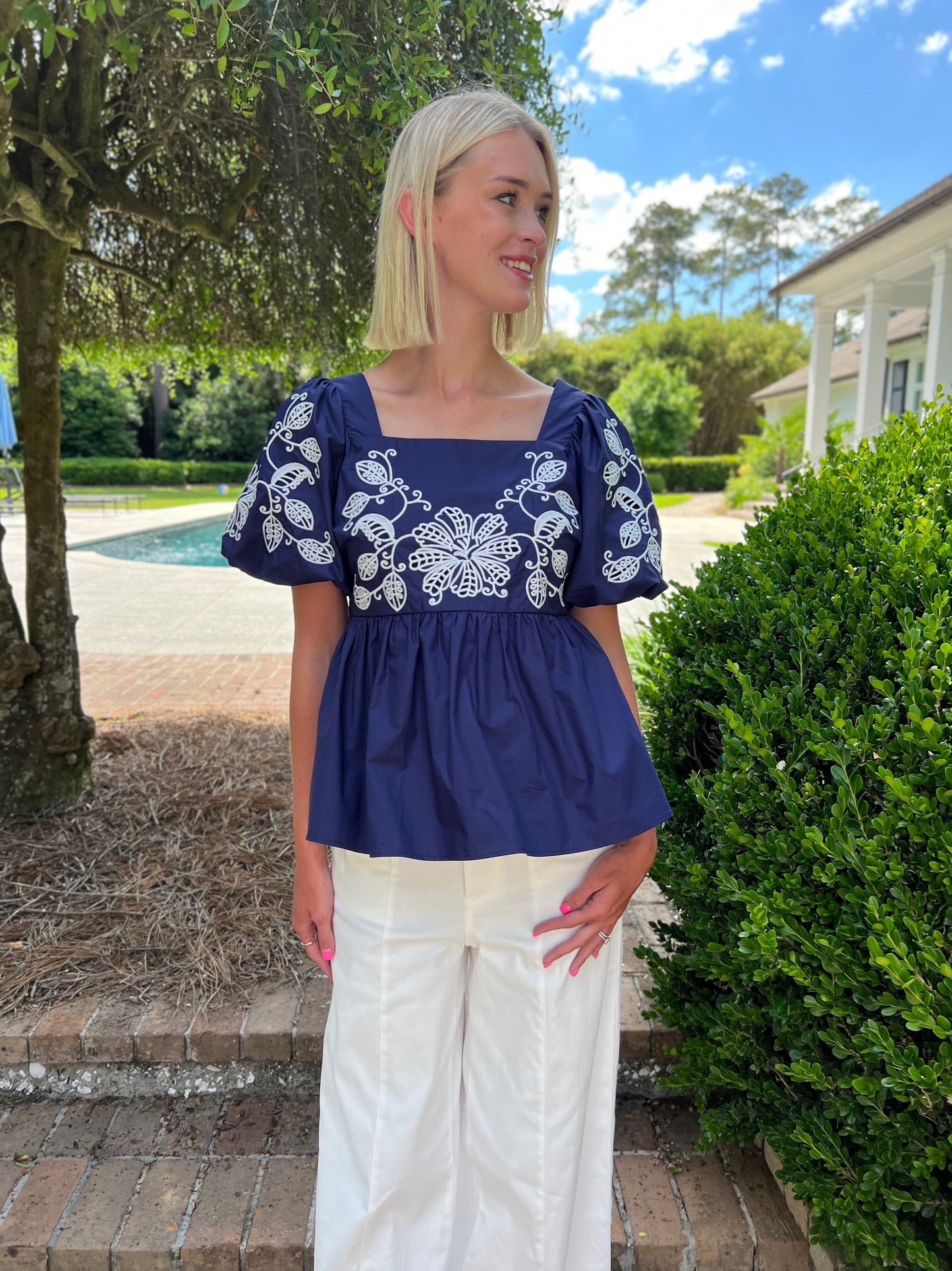 White Floral Embroidered Navy Peplum Top