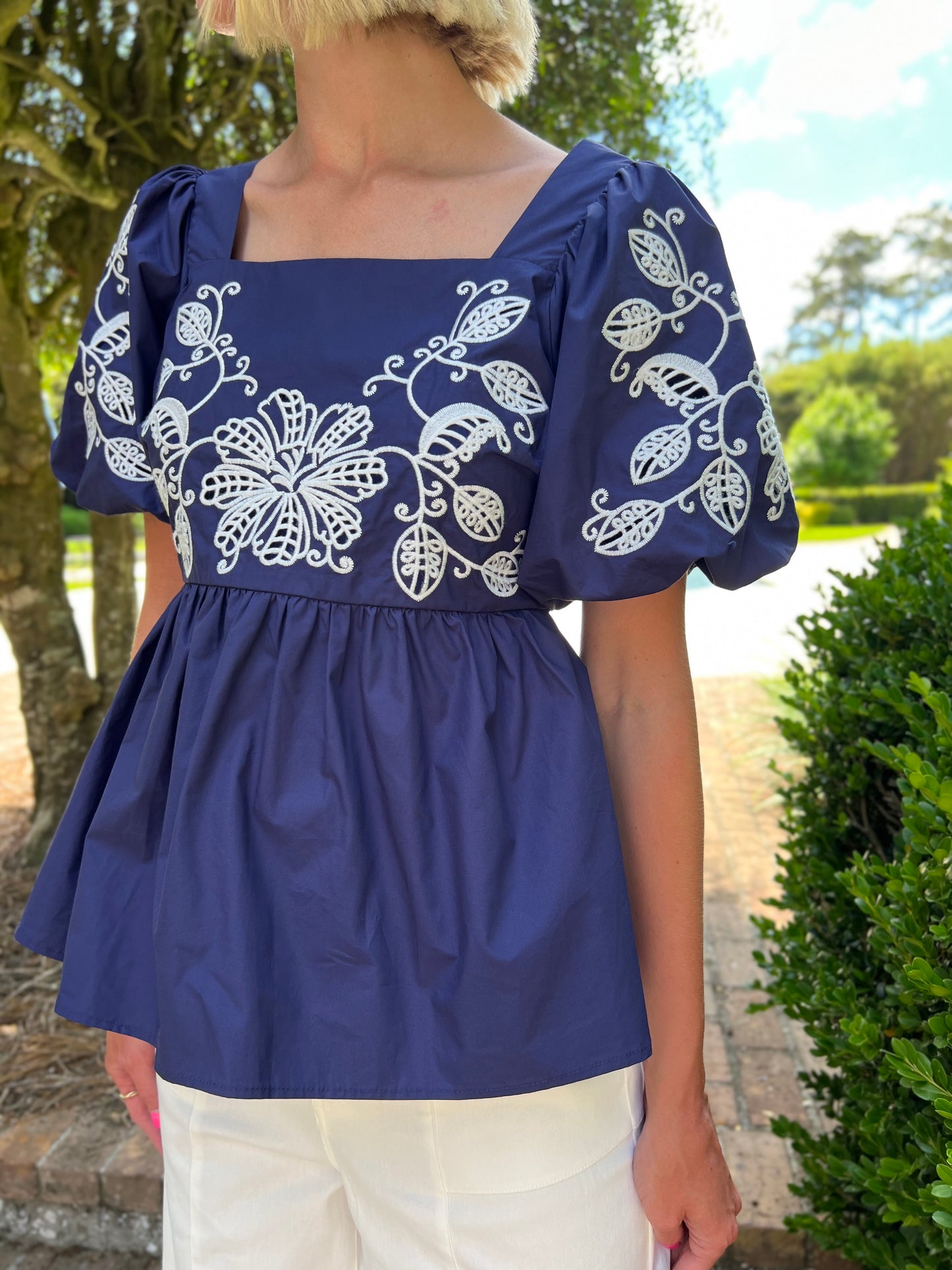 White Floral Embroidered Navy Peplum Top