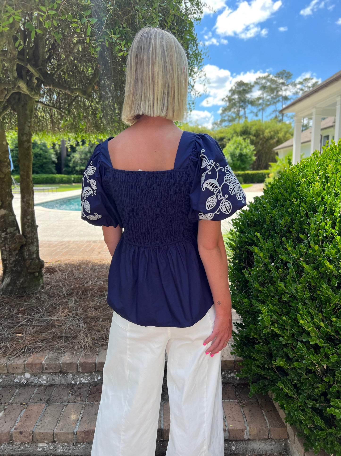 White Floral Embroidered Navy Peplum Top
