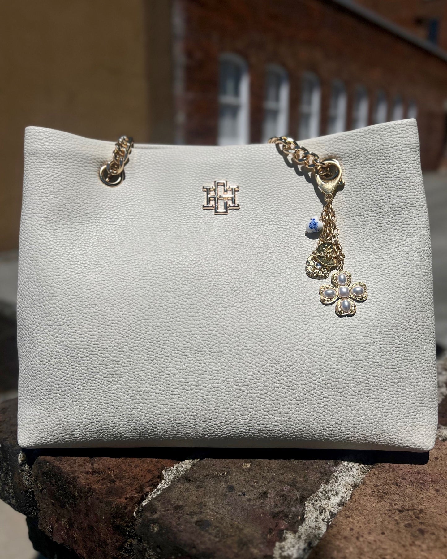 Verona Gold and Pearl Bag Charm Worn Gold