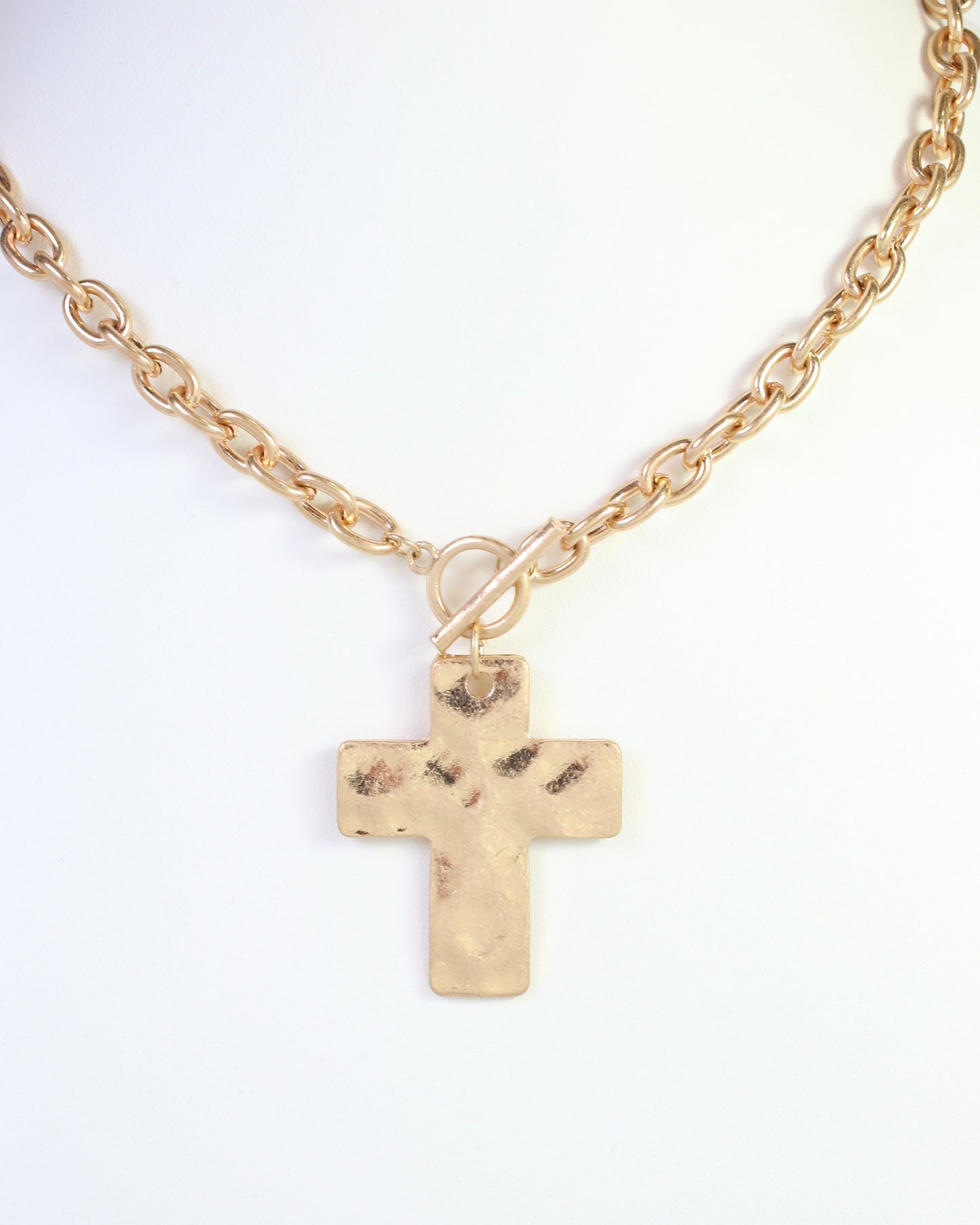 Celeste Hammered Cross Toggle Necklace Worn Gold