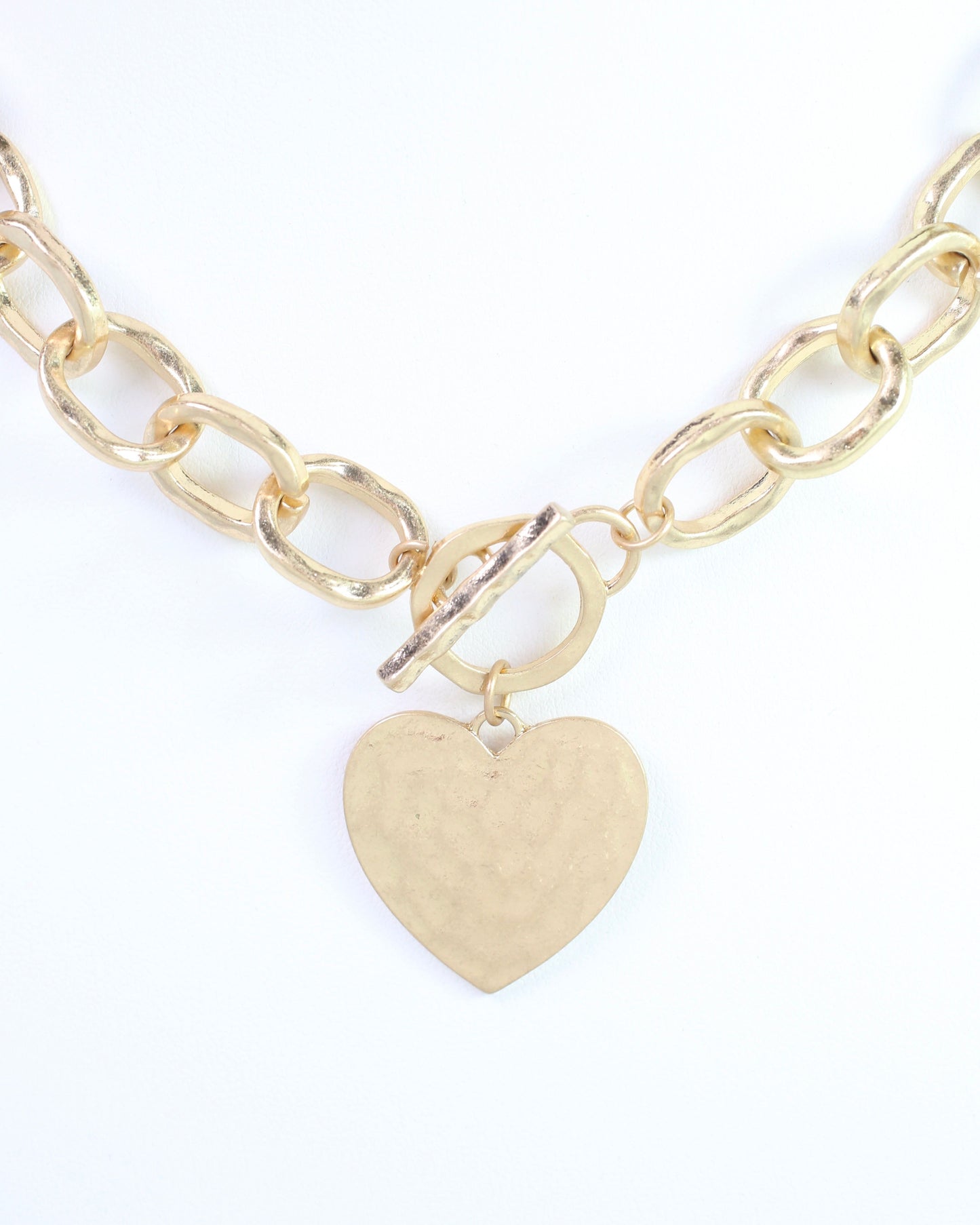 Emi Hammered Heart Charm Toggle Necklace Worn Gold