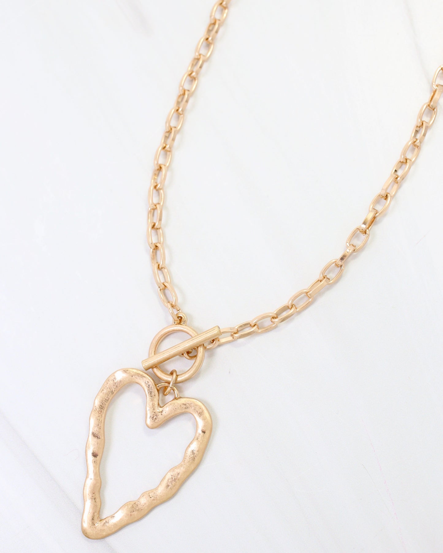 Kris Hammered Heart Toggle Necklace Worn Gold