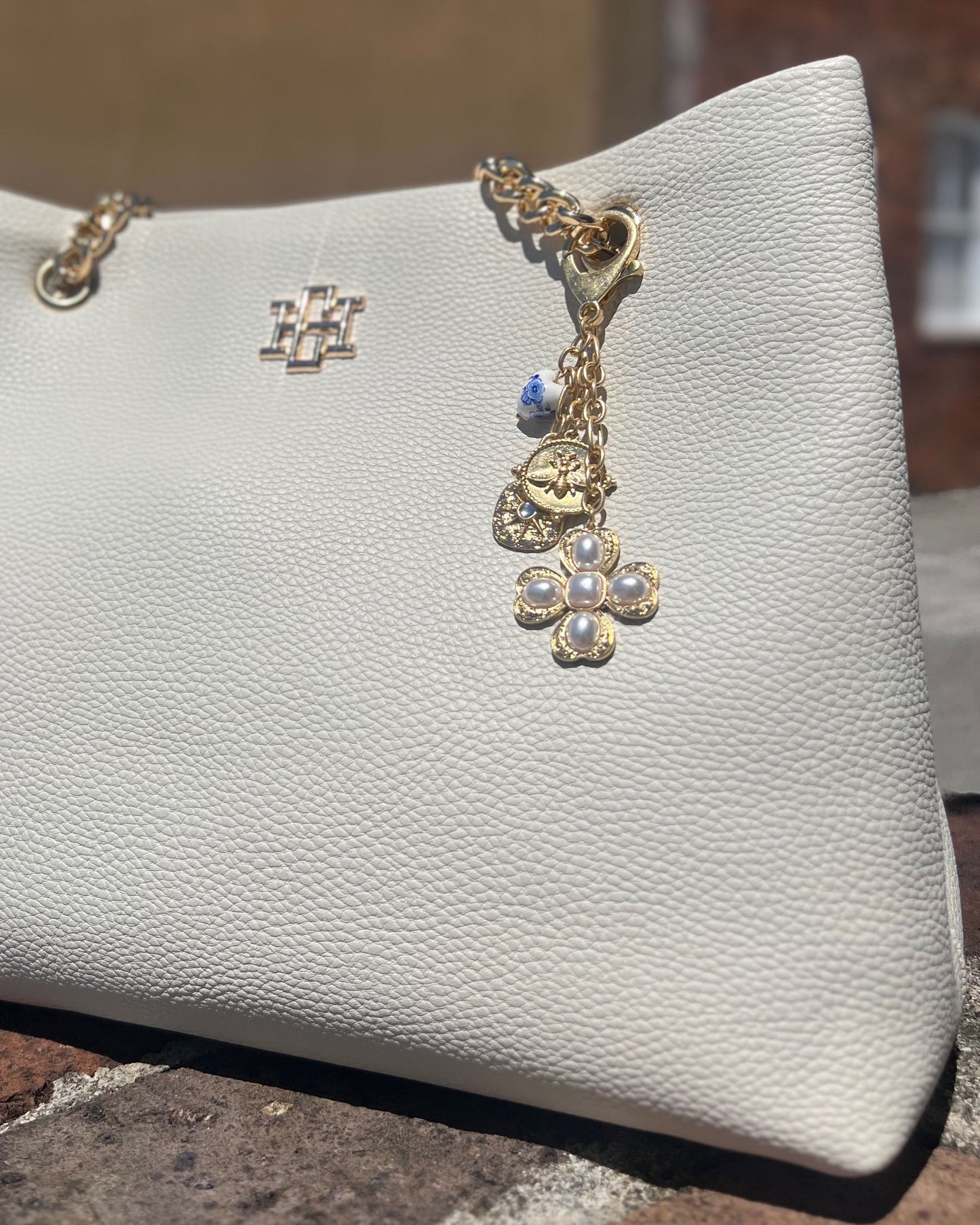 Verona Gold and Pearl Bag Charm Worn Gold