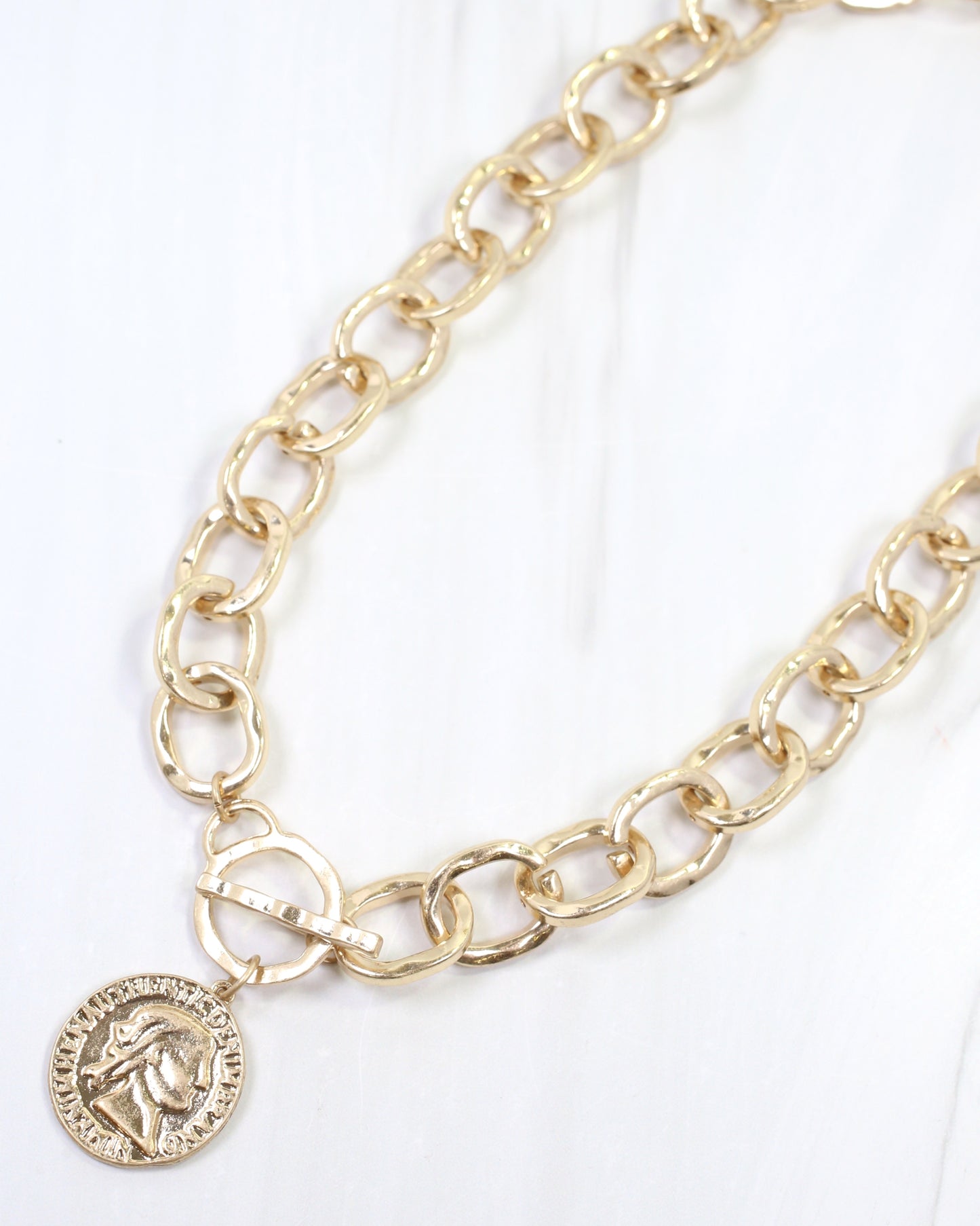 Aubree Hammered Coin Toggle Necklace Worn Gold
